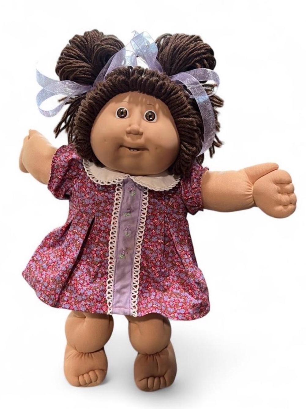 Classic ‘86 Cabbage Patch KidsPlush Doll in Brown Hair with Purple Floral Dress